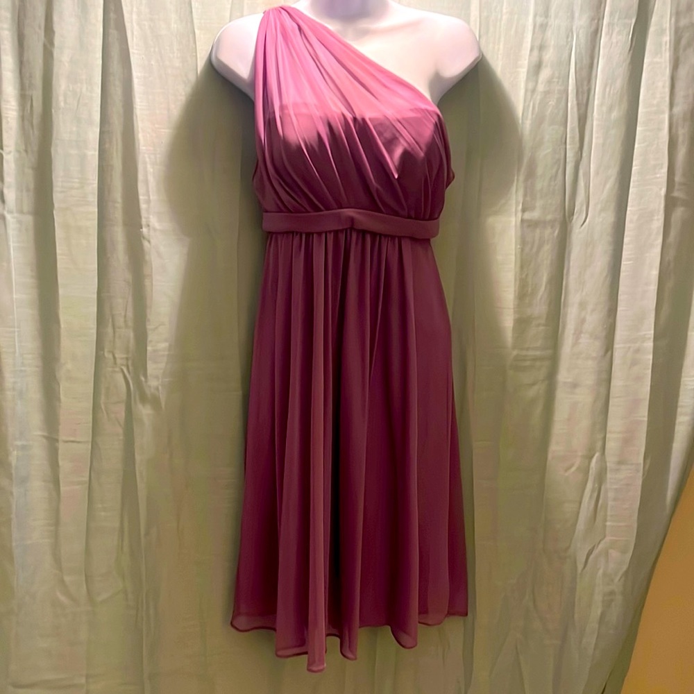 Bridesmaid dress. Size 6. New with tags. The color wisteria.